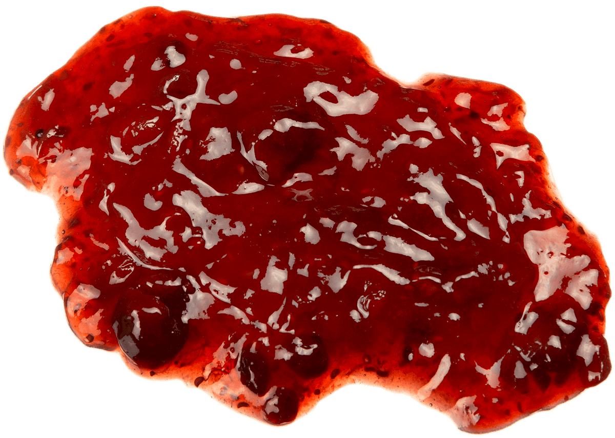 A glossy red fruit spread or jam with visible chunks, photographed on a solid black background.